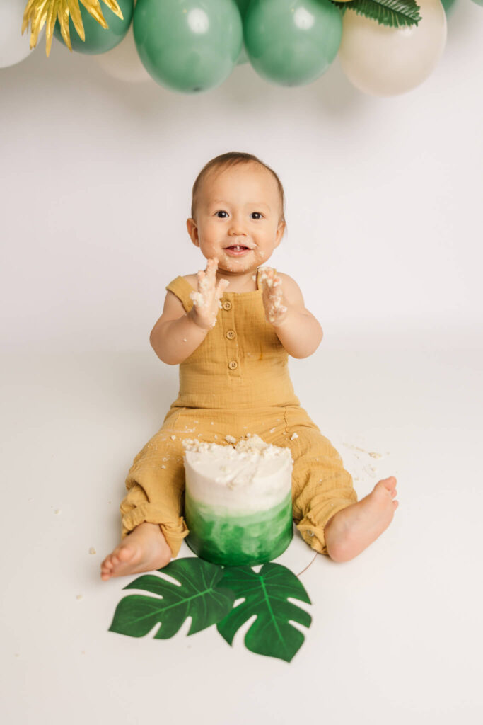 One year old enjoying his cake during his one year photography session.