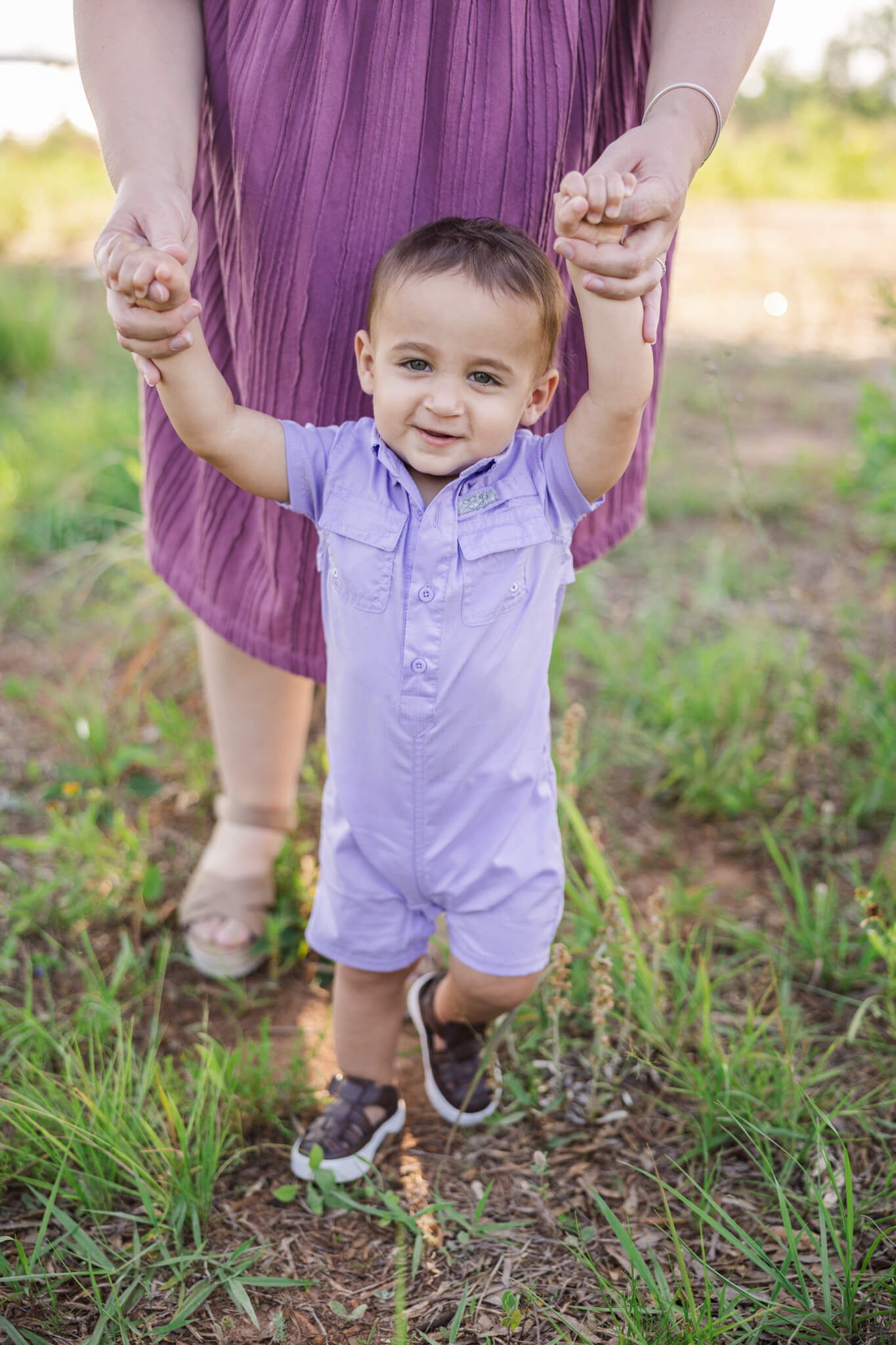 Mom and son walking during their family photography session.