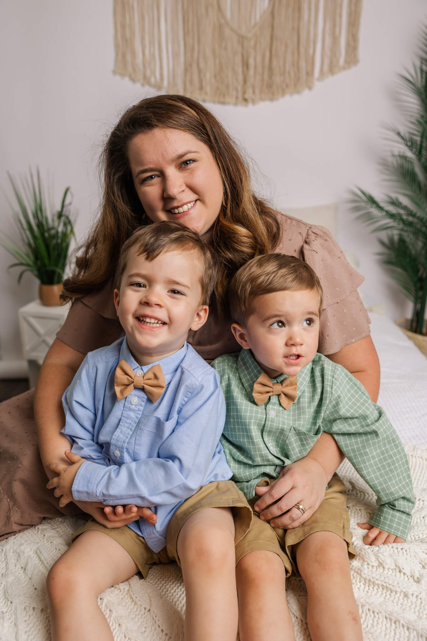 Mom and two boys capturing a sweet moment together during their motherhood session in the studio by Molly berry photography | augusta family photographer.