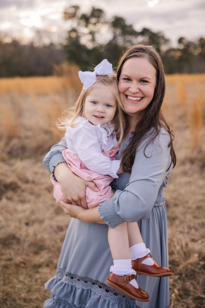 Mom and daughter hugging during their family session in Grovetown, GA. 
swim lessons in augusta ga
