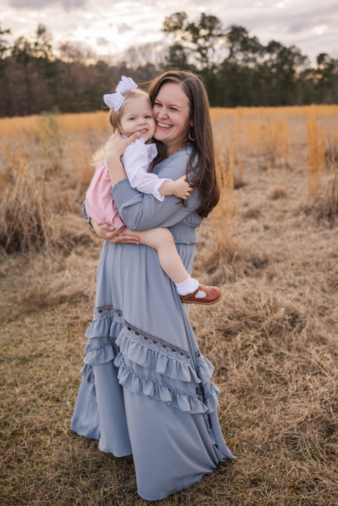 Mom and three year old dancing around during their augusta family photography session captured by molly berry photography. swim lessons in augusta ga