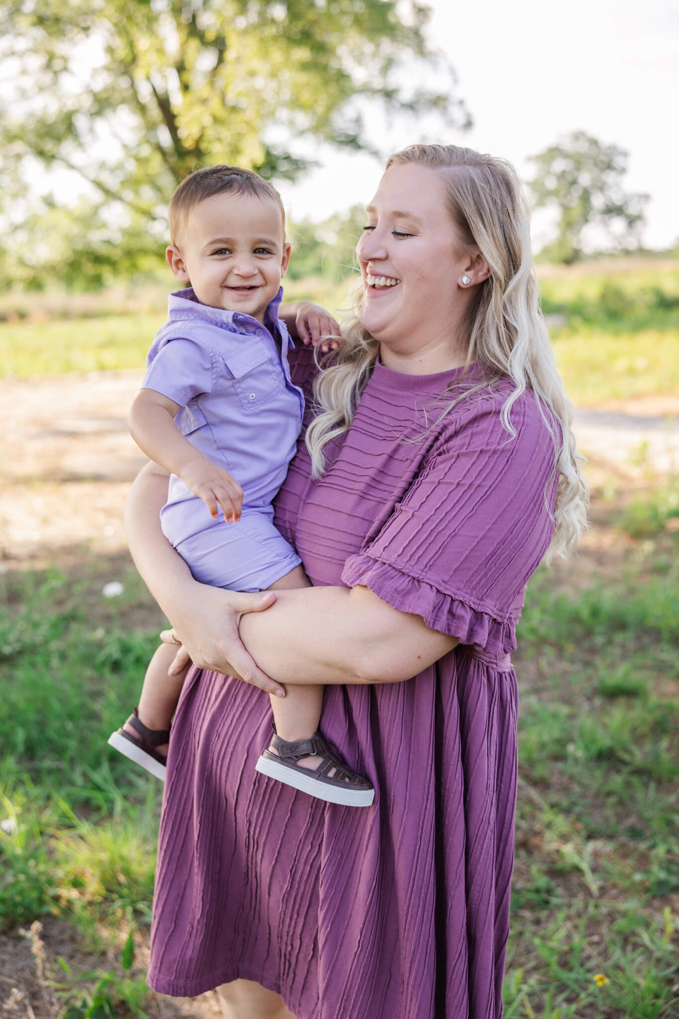 Mom and son laughing during their photographer session with Molly Berry Photography. Date Night Restaurants Augusta GA