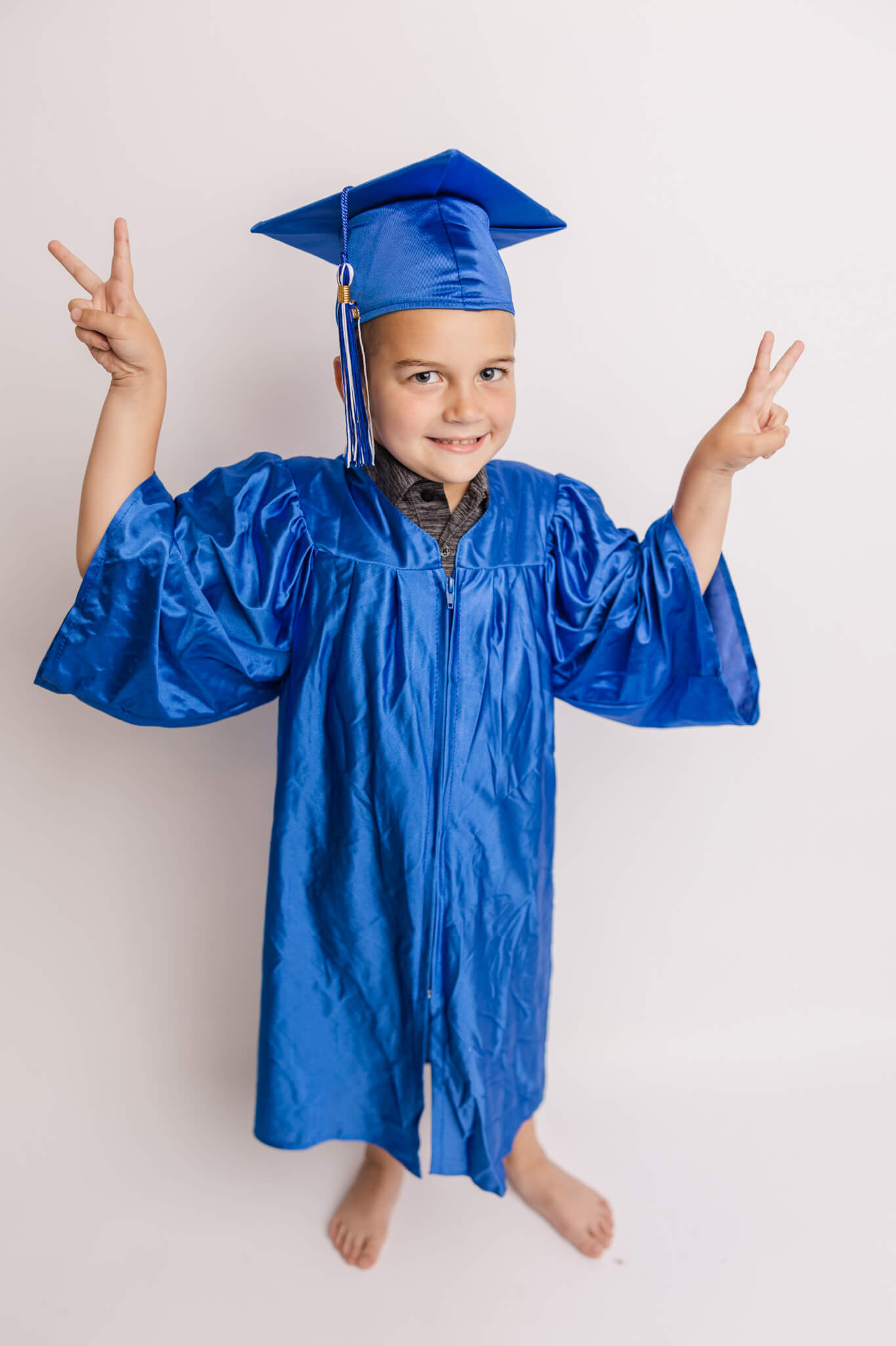 Four year old showing off his 2022 graduation from preschool.  Highly-Rated Augusta Preschools