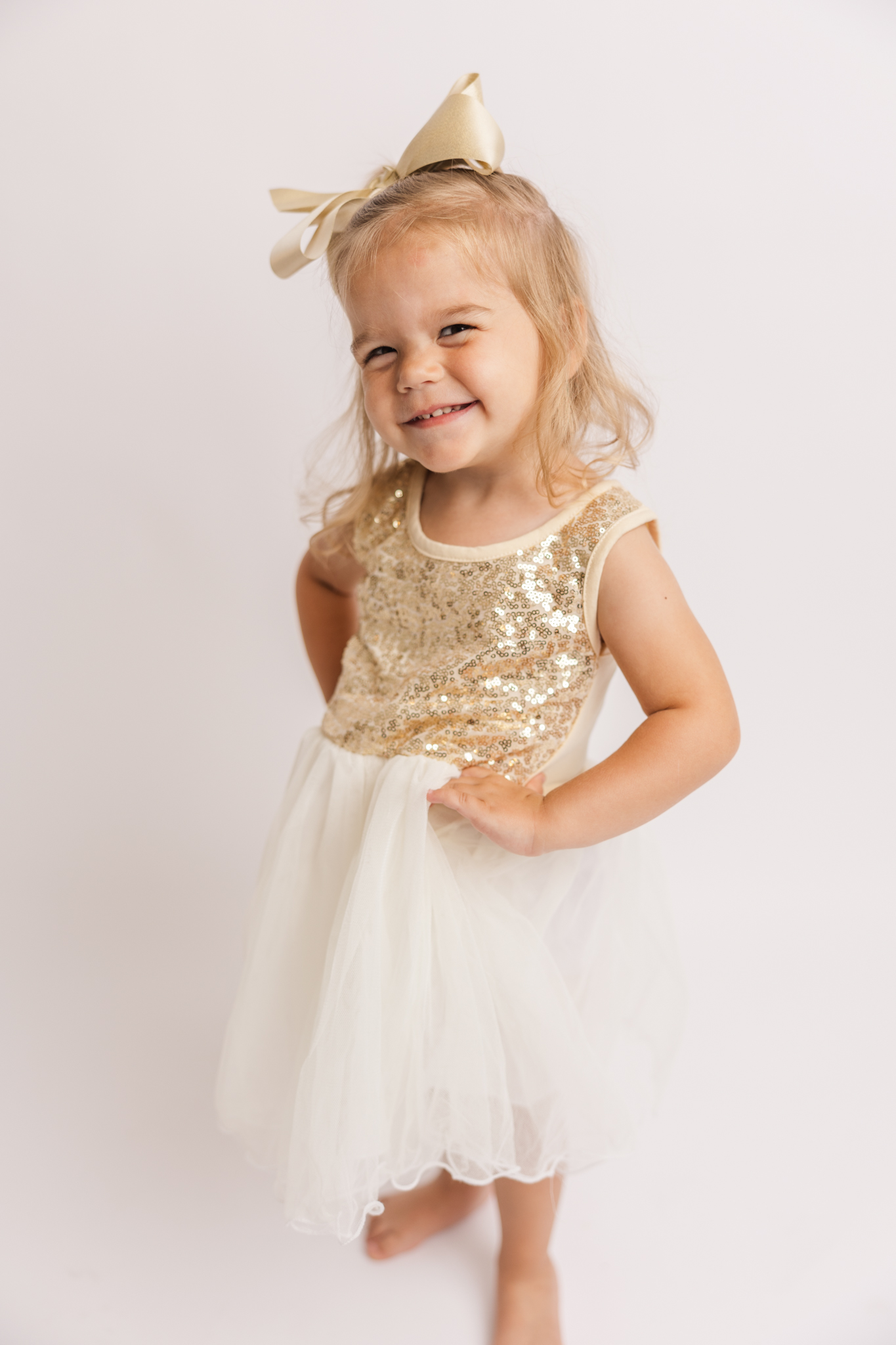 Two year old showing off her attitude during milestone session in the studio my Molly Berry Photography.