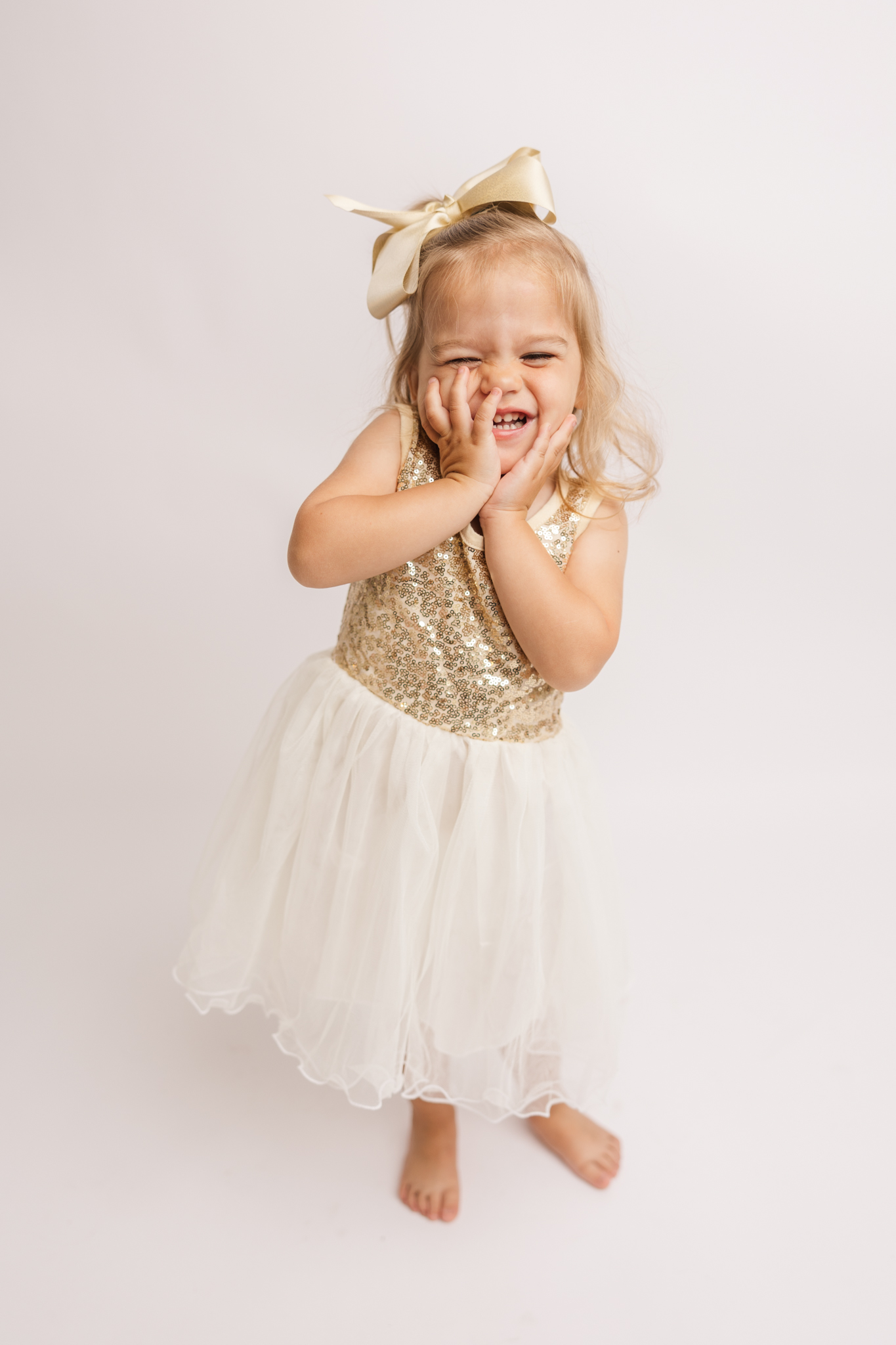 Two year old twirling during her milestone studio session.