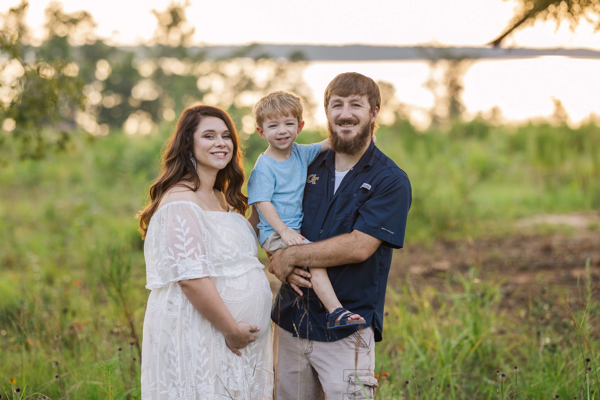 Family portrait of mom, dad and older brother before they welcome their sweet baby girl into this world in a few short weeks. Portrait captured by molly berry photography. birthing center augusta ga