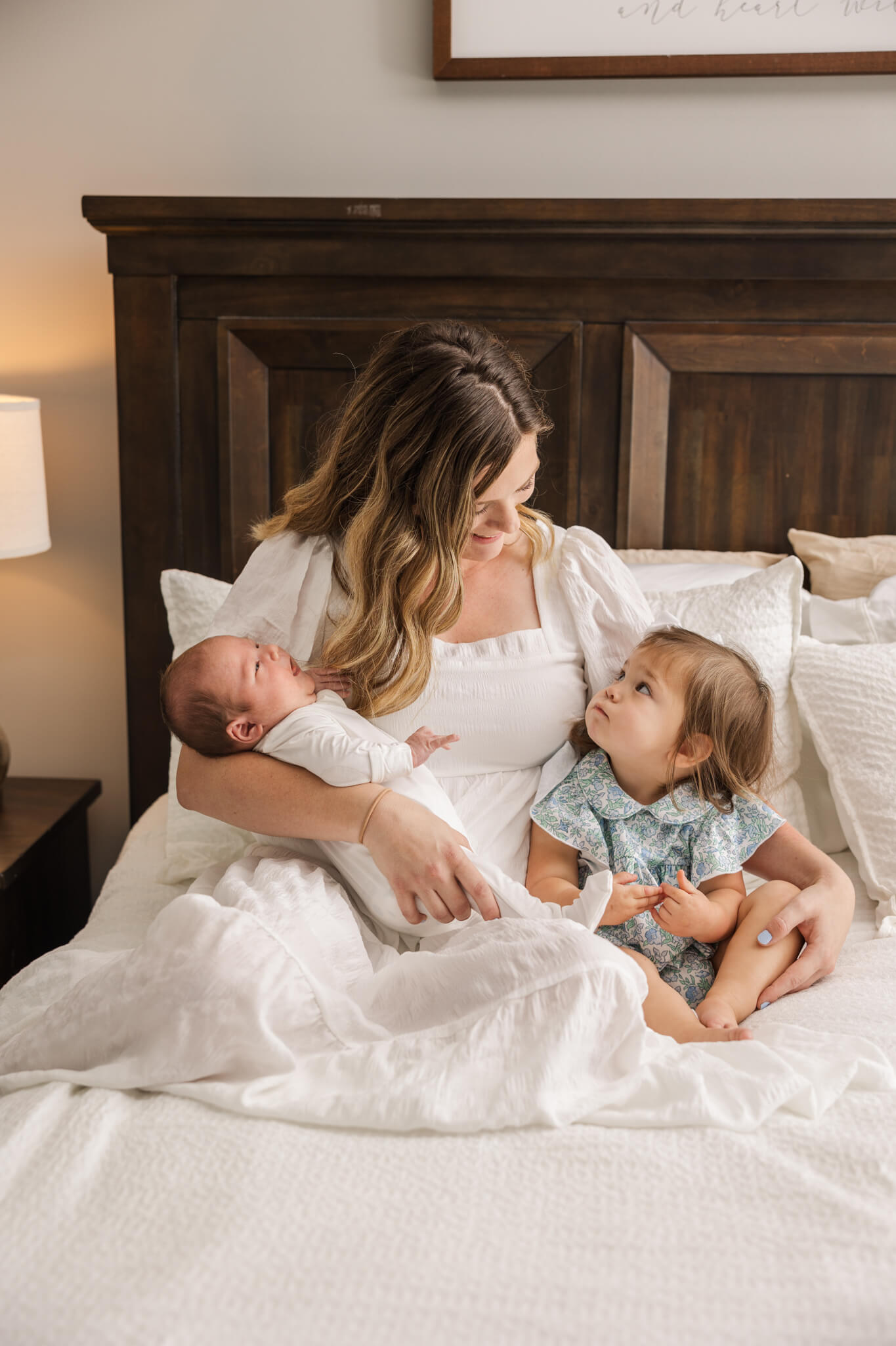 Mom with her two youngest kids during their recent in home newborn session captured by Molly Berry photography. The Swank Company