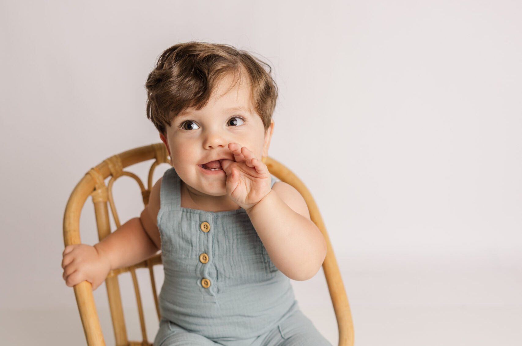 One Year Old enjoying his milestone portion of his cake smash session with molly berry photography
