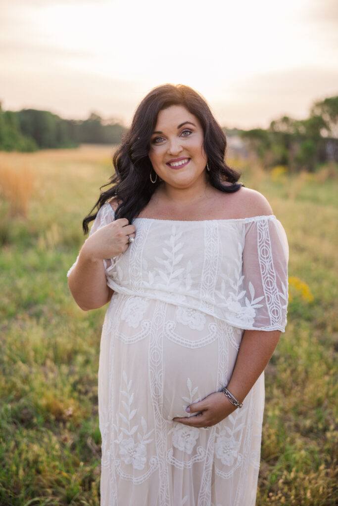 Expecting mom wearing a white Baltic Born dress. Mom is expecting her third child. Photo captured by Molly Berry Photography