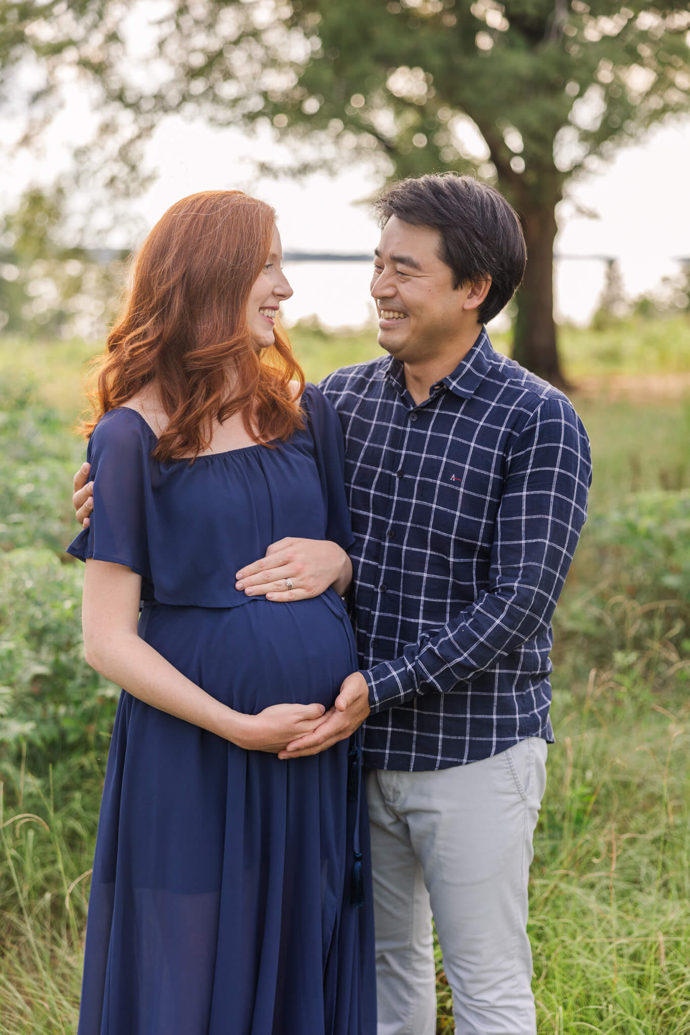 Mom and dad capture a moment together during recent maternity session captured by molly berry photography - your augusta maternity photographer.