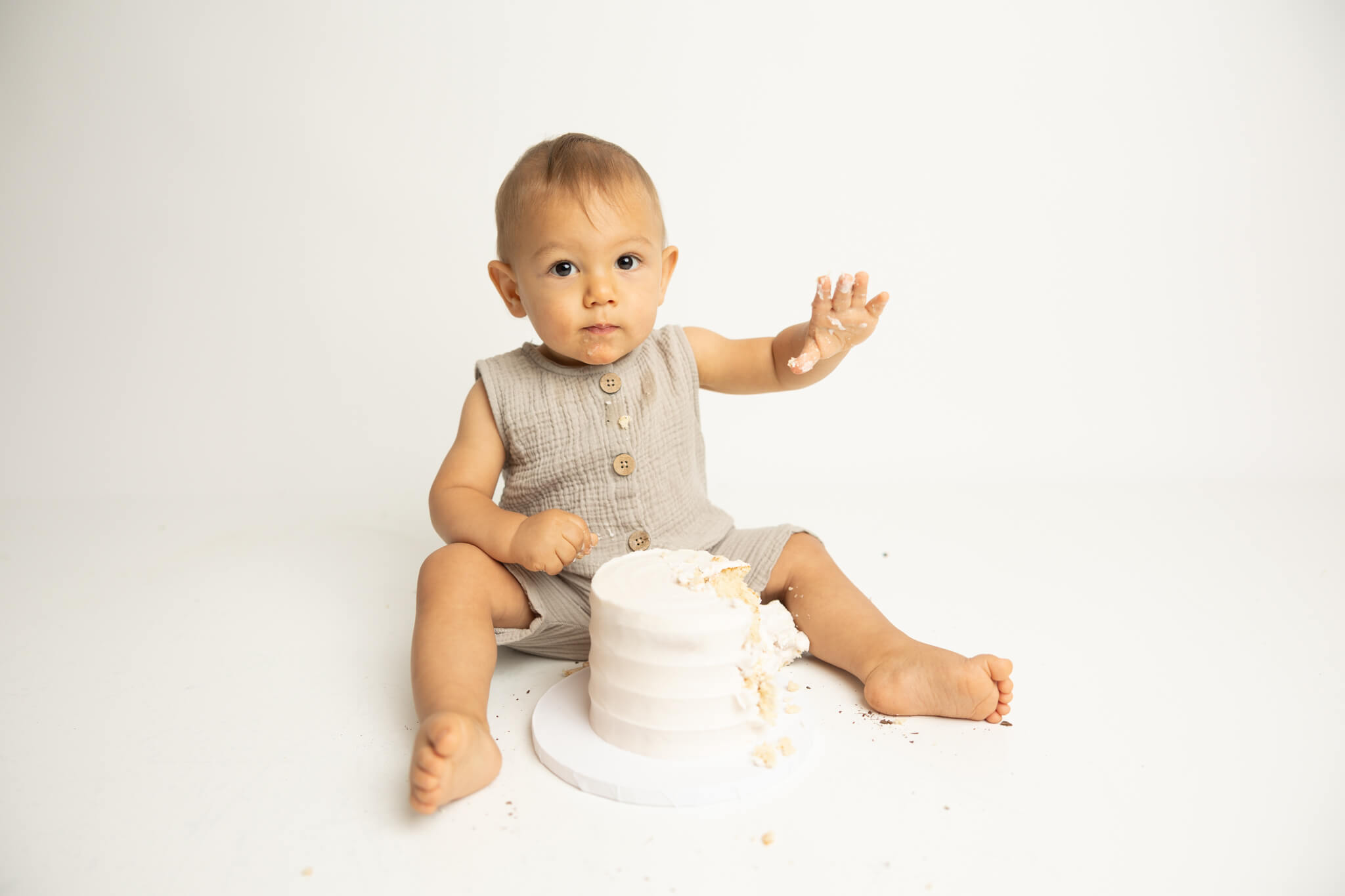 Little boy with cake for his first birthday