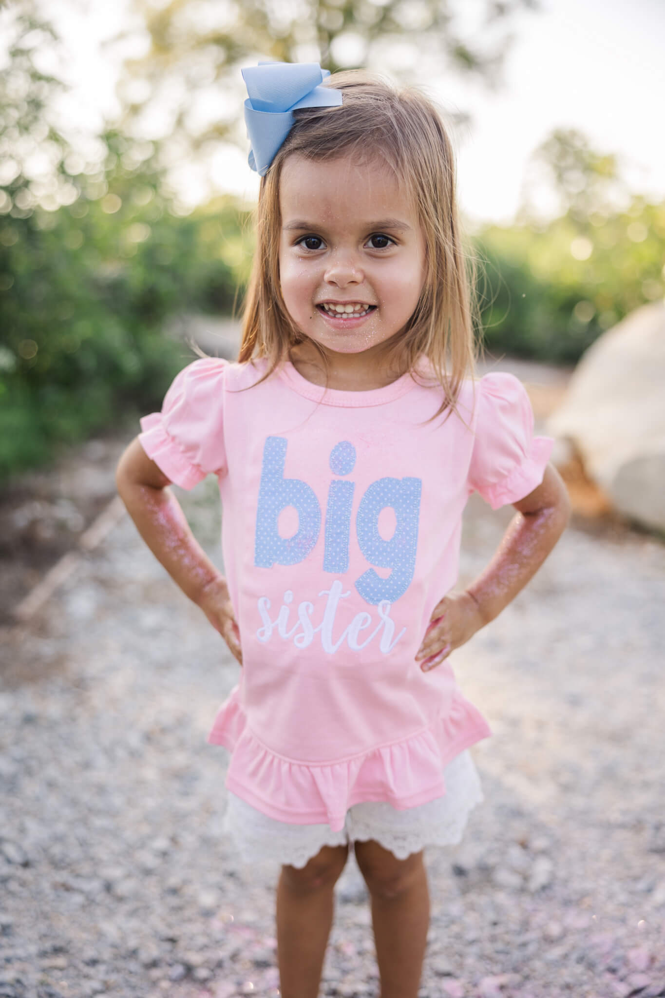 4 year old announcing that she is being promoted to big sister during recent family photography session by molly berry photography.
