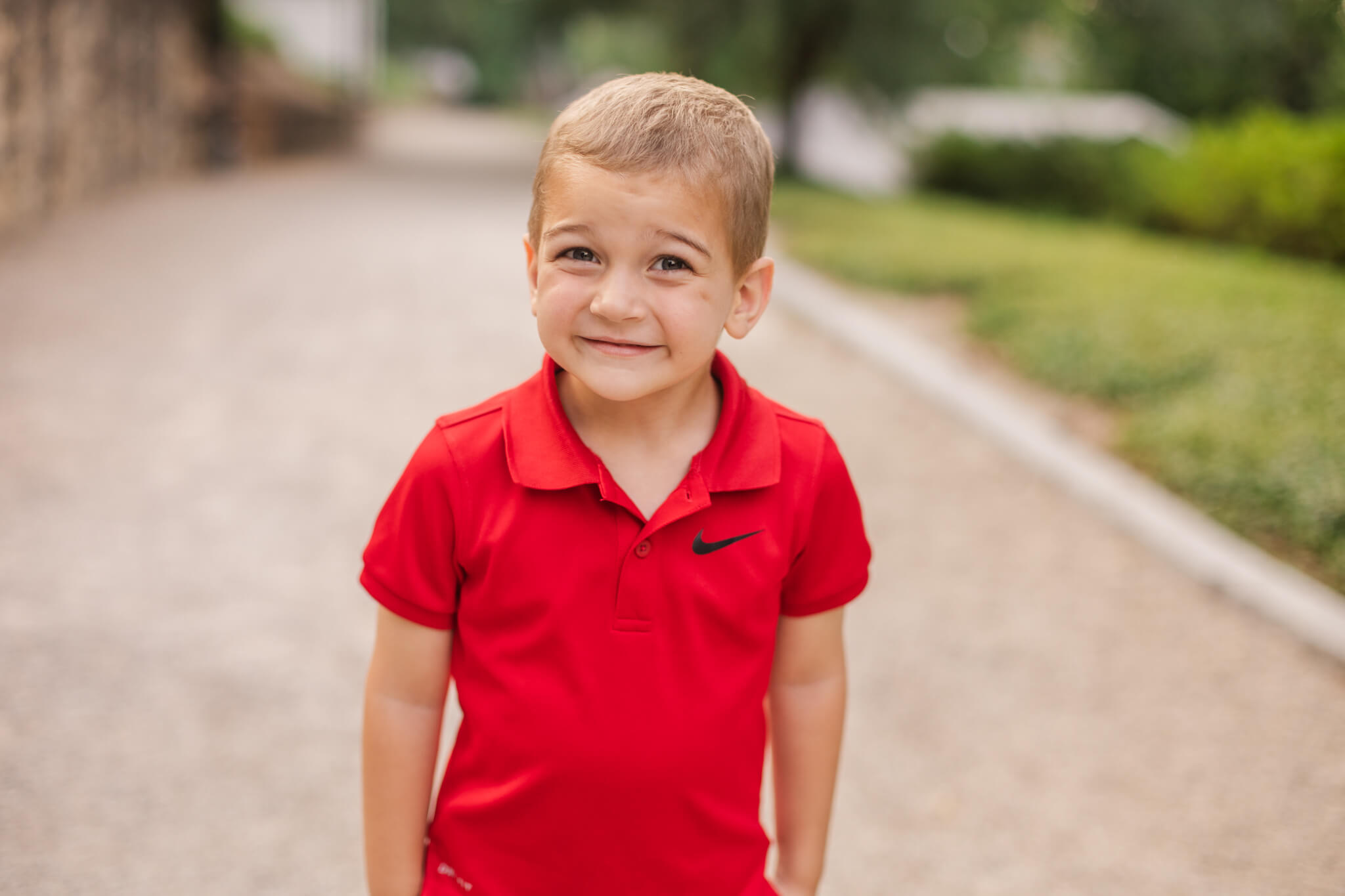 little boy in a red polo cheesing for the camera Southern Smiles Pediatric Dentistry