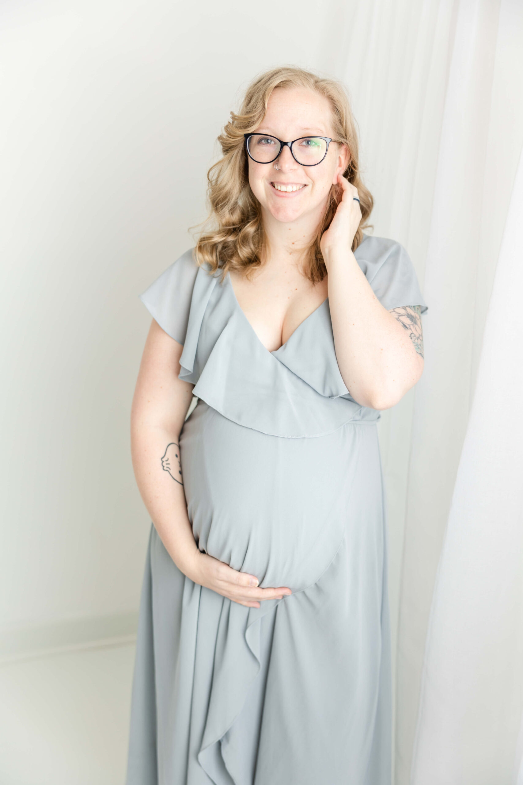 Expecting mom in baby blue dress.