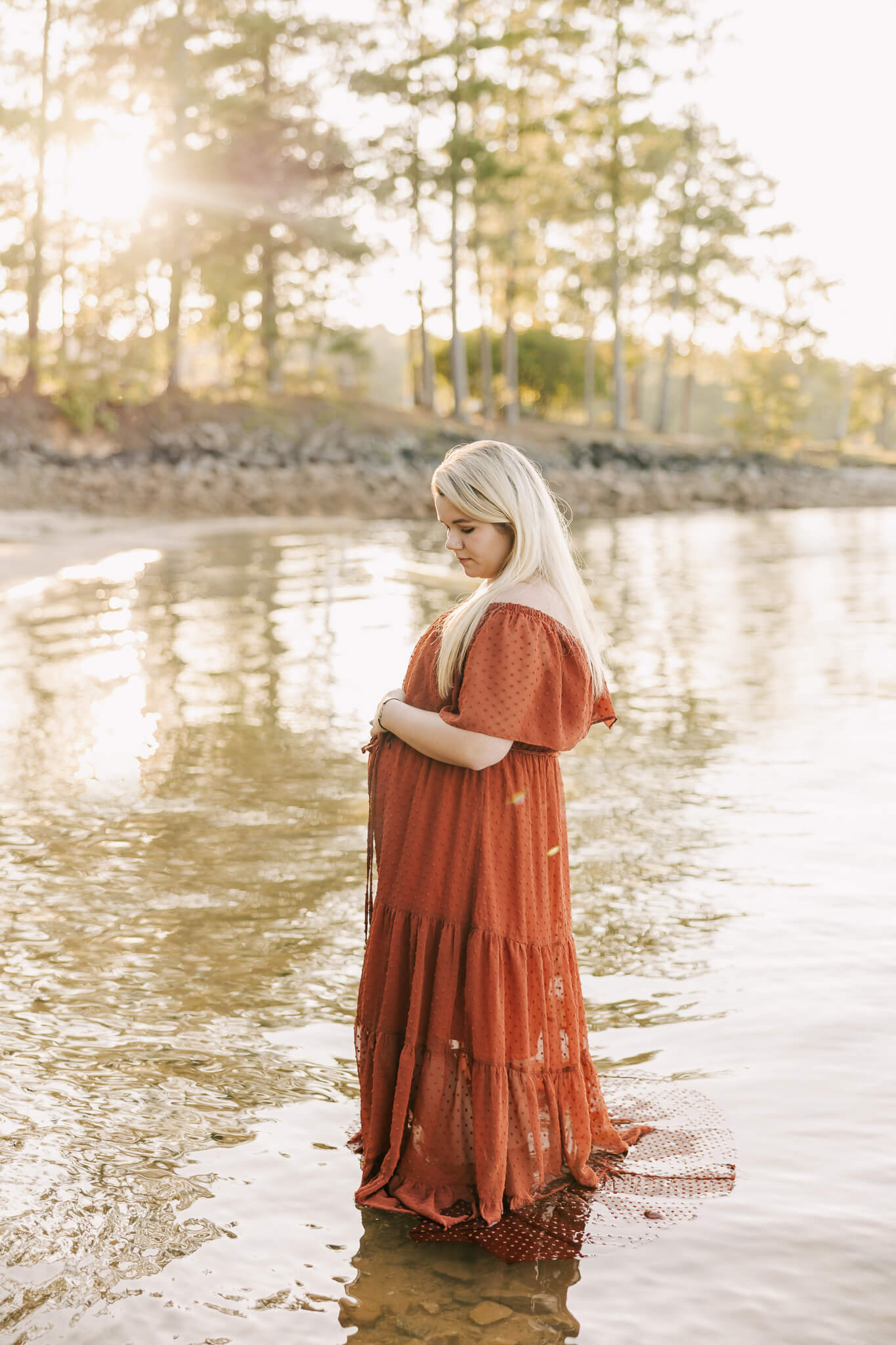 Expecting mom standing in the lake during her maternity session with molly berry. 5 Highly-Rated Baby Shower Venues in Augusta GA
