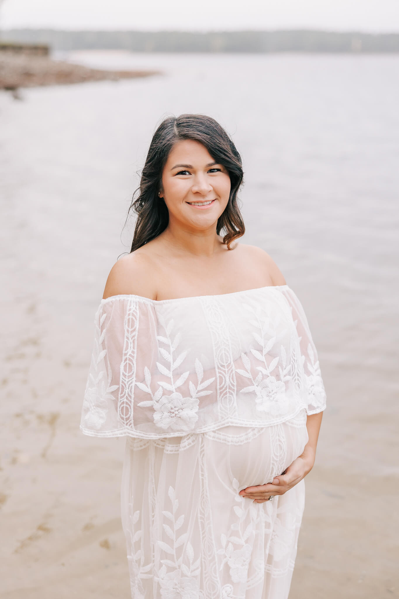 Pregnant mom holding her belly during her augusta maternity portrait session