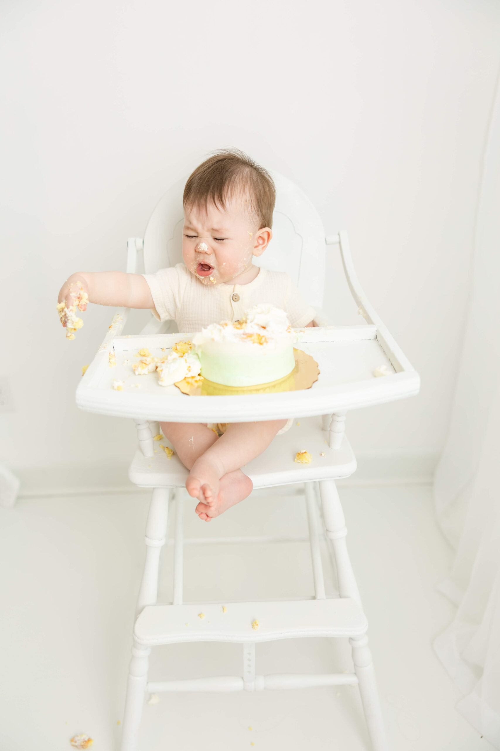 What a face captured on this little man during his cake smash session with Molly Berry Photography.