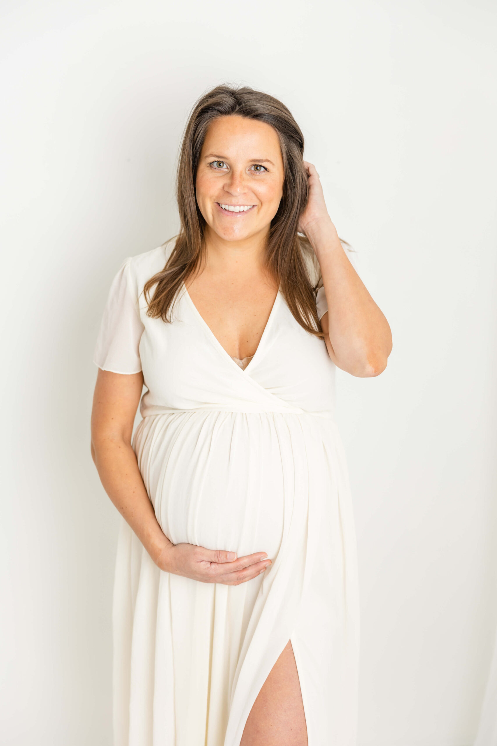 Soon-to-be Mom in white dress from client closet. Mom had an elective ultrasound of her baby boy at one of the Top Two Elective Ultrasound Centers in Augusta