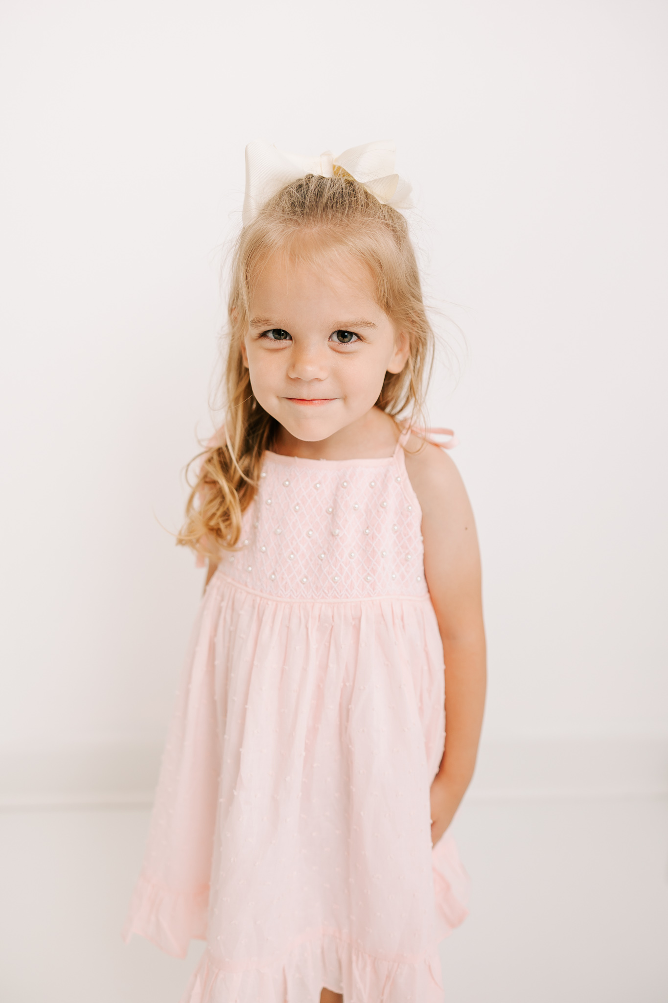 Three year old smiling during her studio session.