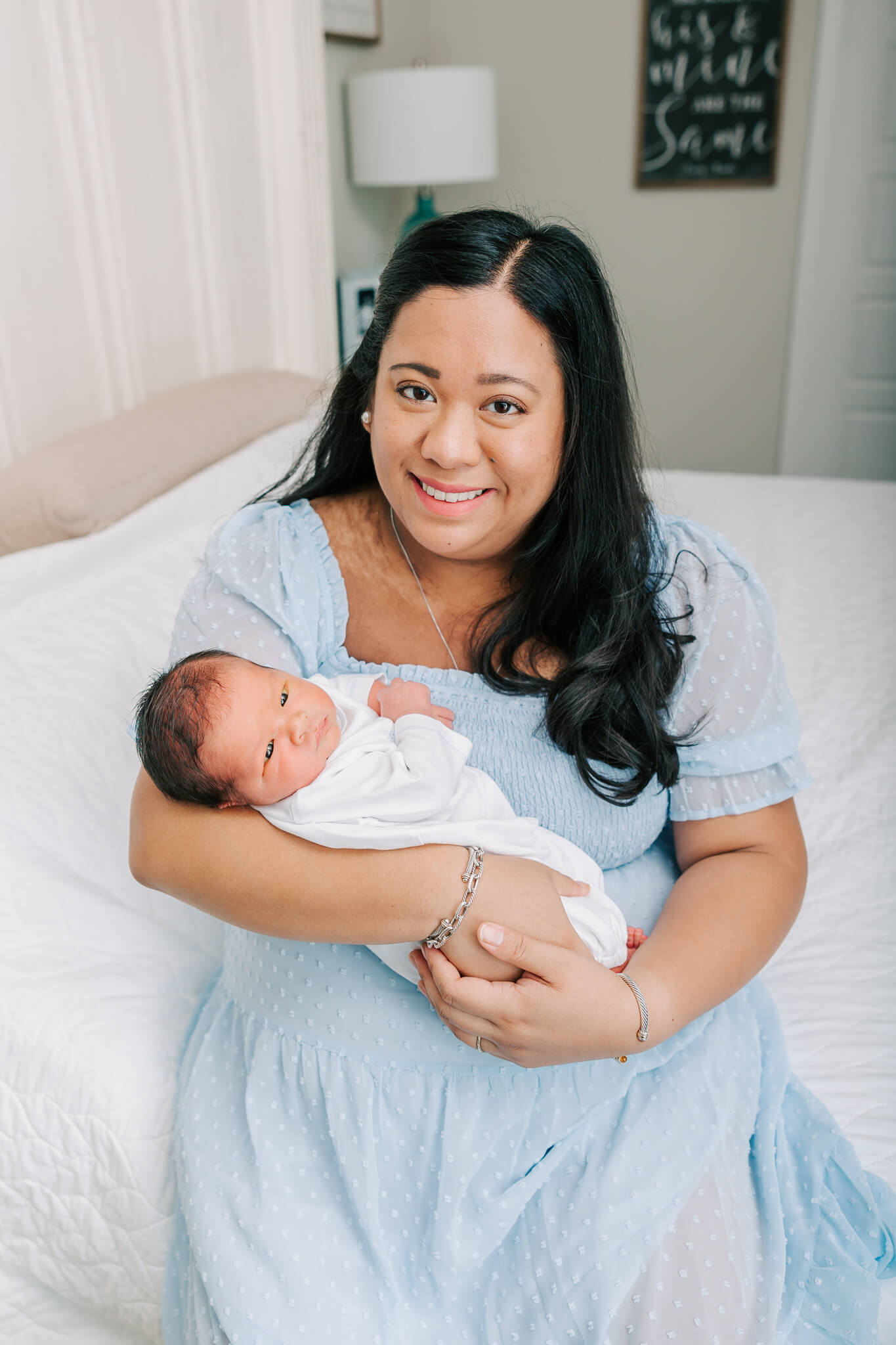 Mom and sweet baby sharing a precious moment during their newborn session. Mom shops at Duck Duck Goose Columbia SC