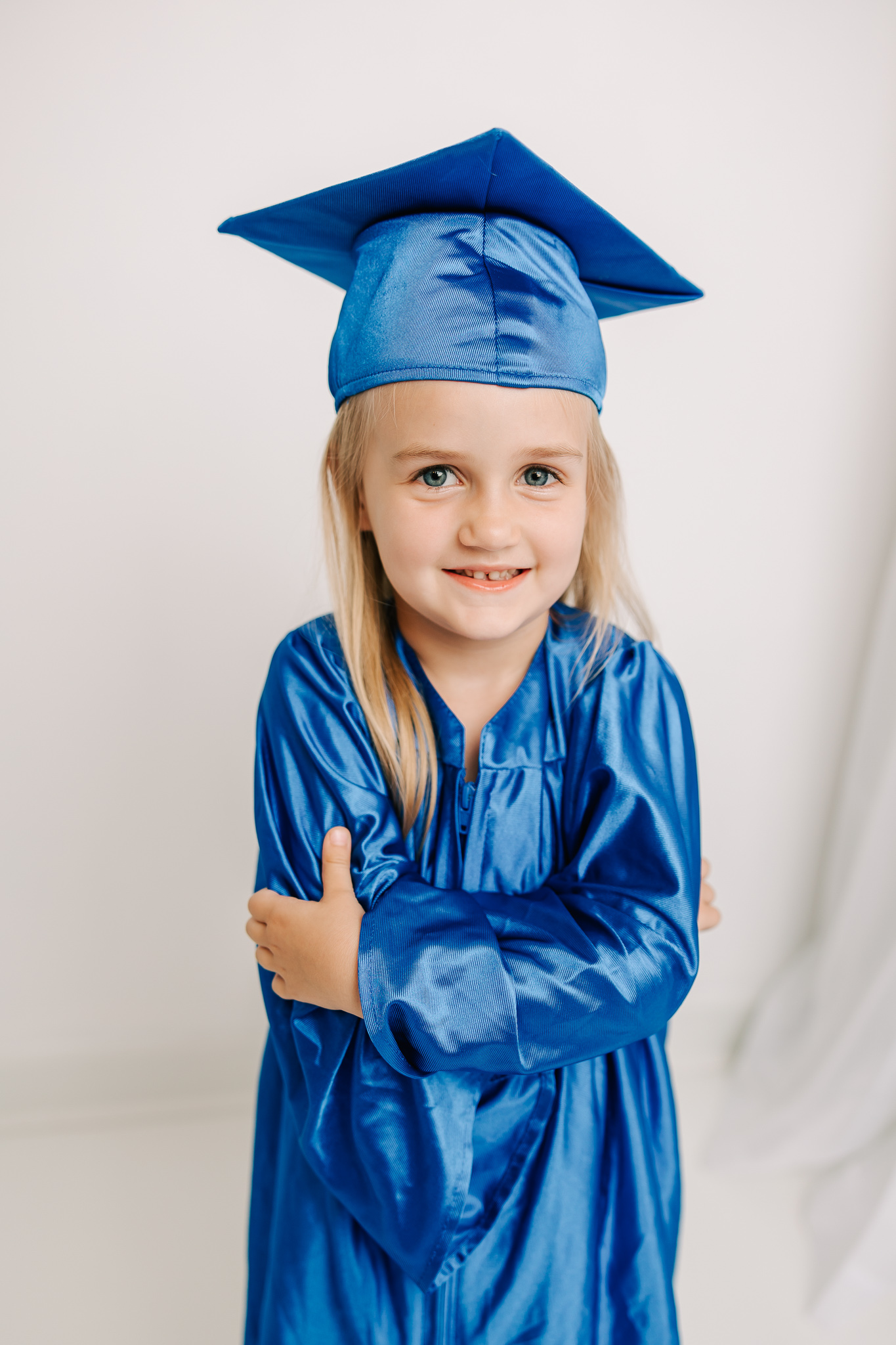 5 year old girl dancing in the studio during her recent milestone graduation session. Little girl is excited to use Kaitlyn Marie & Co. for further parties.