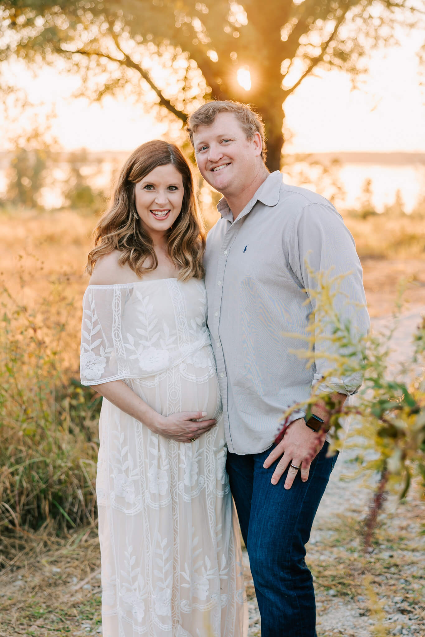 Whitney Collins, David Greene Realty and her husband during their augusta maternity photography session with molly berry photography.
