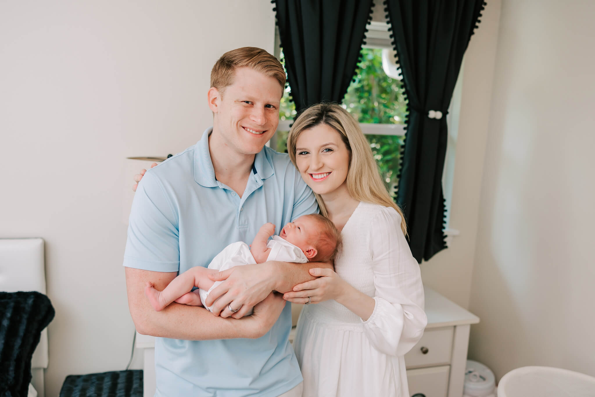 New family of three sharing a moment together during their inhome newborn session in Atlanta. Mom used Breastfeed Atlanta for lactation help.