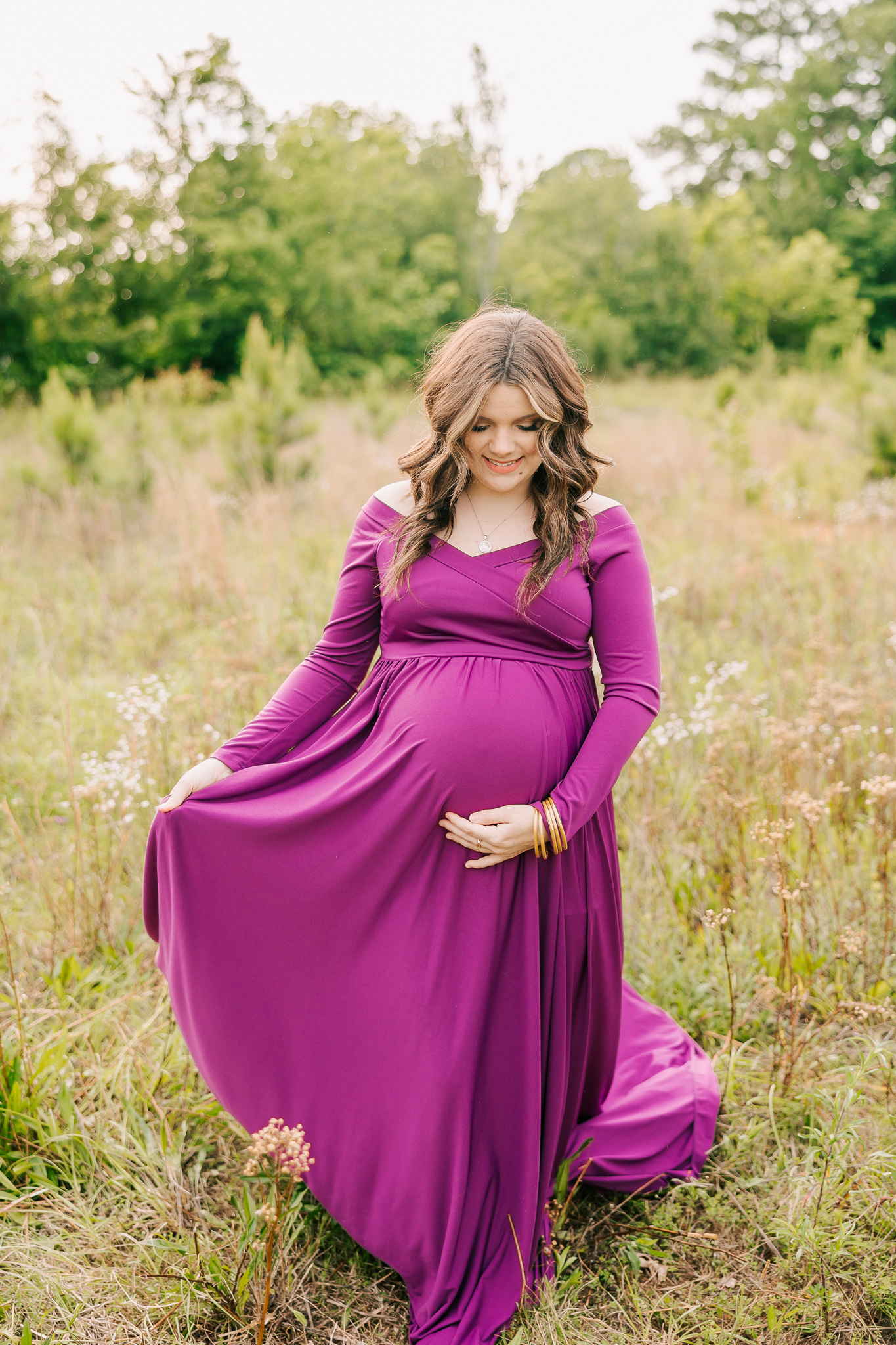 Pregnant mom wearing a purple dress during her atlanta maternity photography session with molly berry