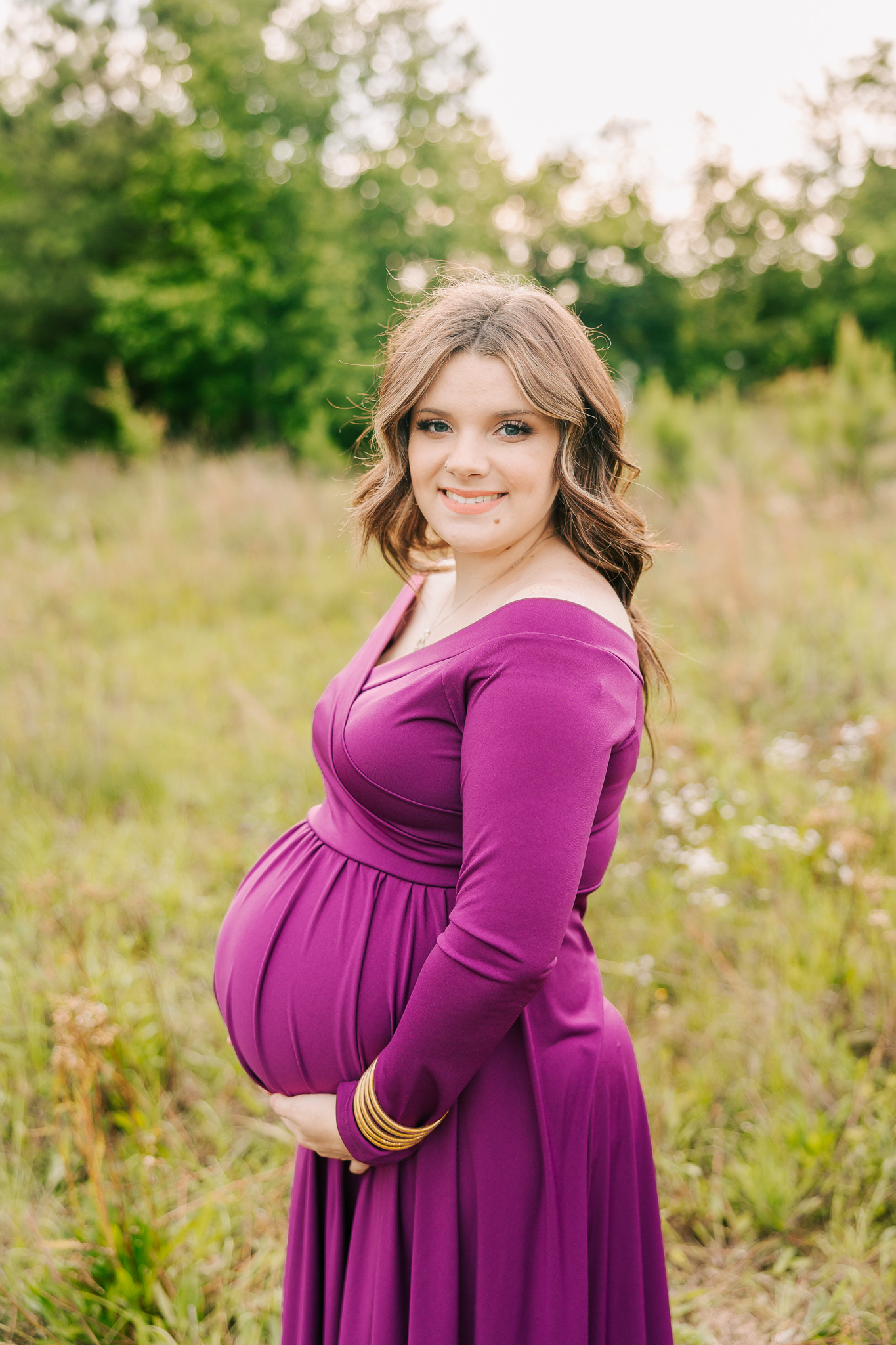 Pregnant mom wearing a purple dress from the client closet of molly berry photography. mom is using one of these Placenta Encapsulation Atlanta for her birth.