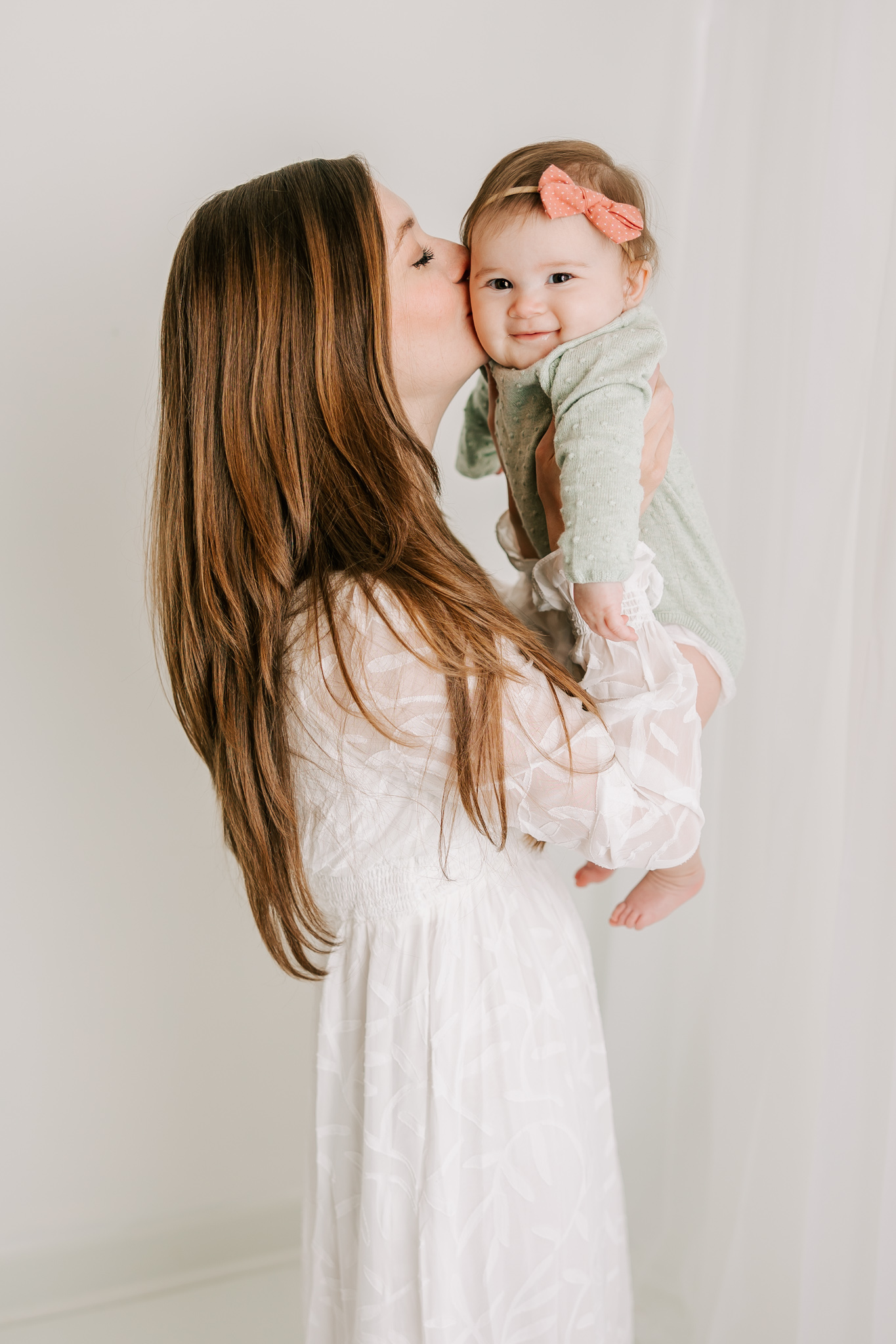 Mom and daughter sharing a special moment during their atlanta baby photography session with molly berry photography.