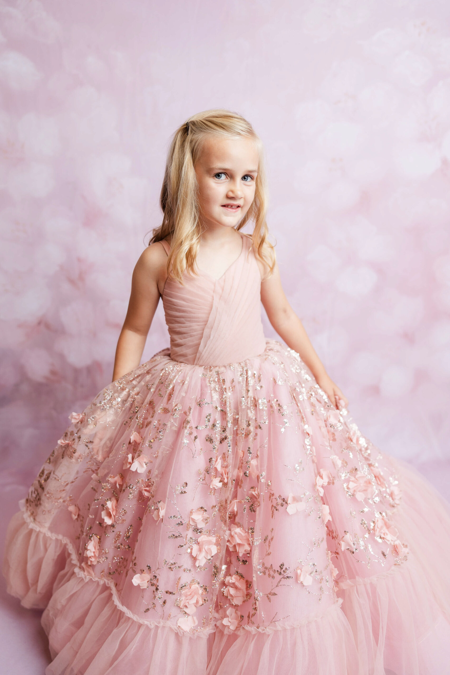 Six year old in a pink dress in the studio of Molly Berry Photography