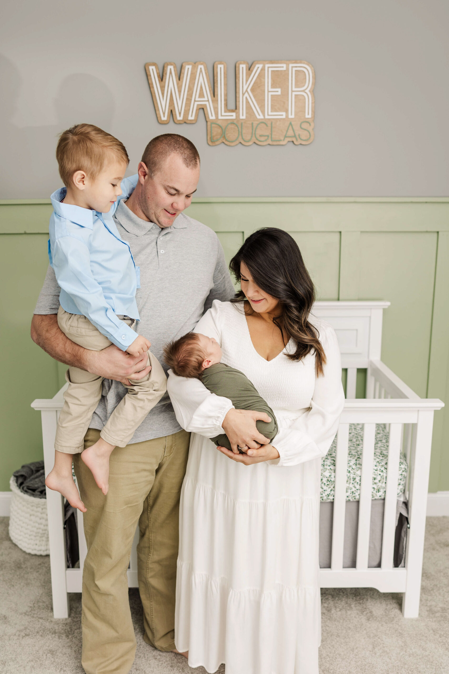 Family of four capturing their newborn session in their home in Aiken, SC 