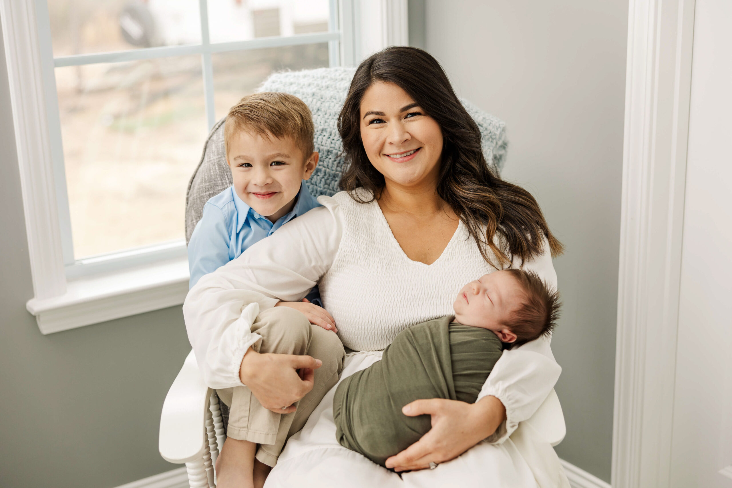 Mom with her boys during her newborn session with molly berry photography 