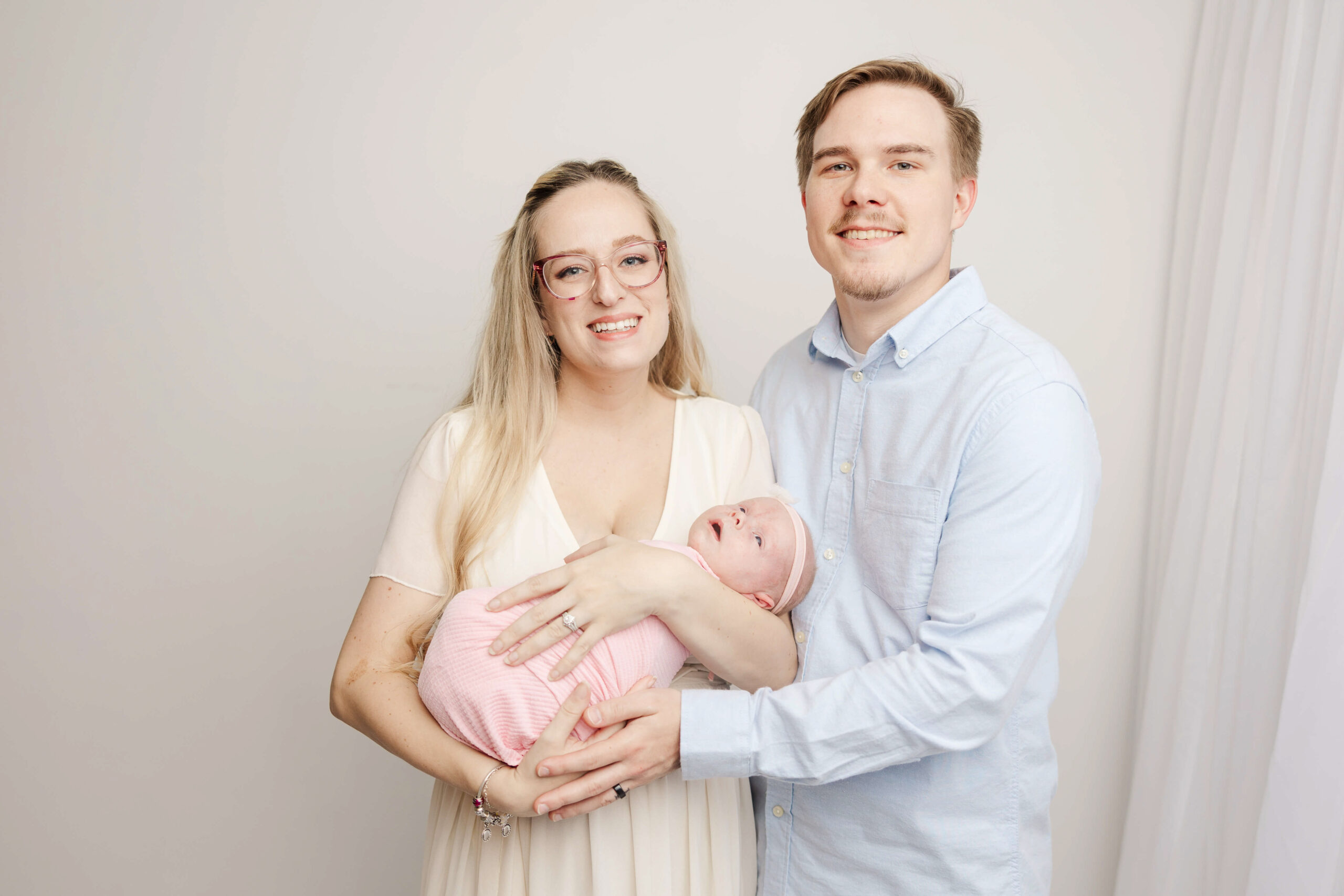 Mom, Dad and baby girl during studio session with Molly Berry