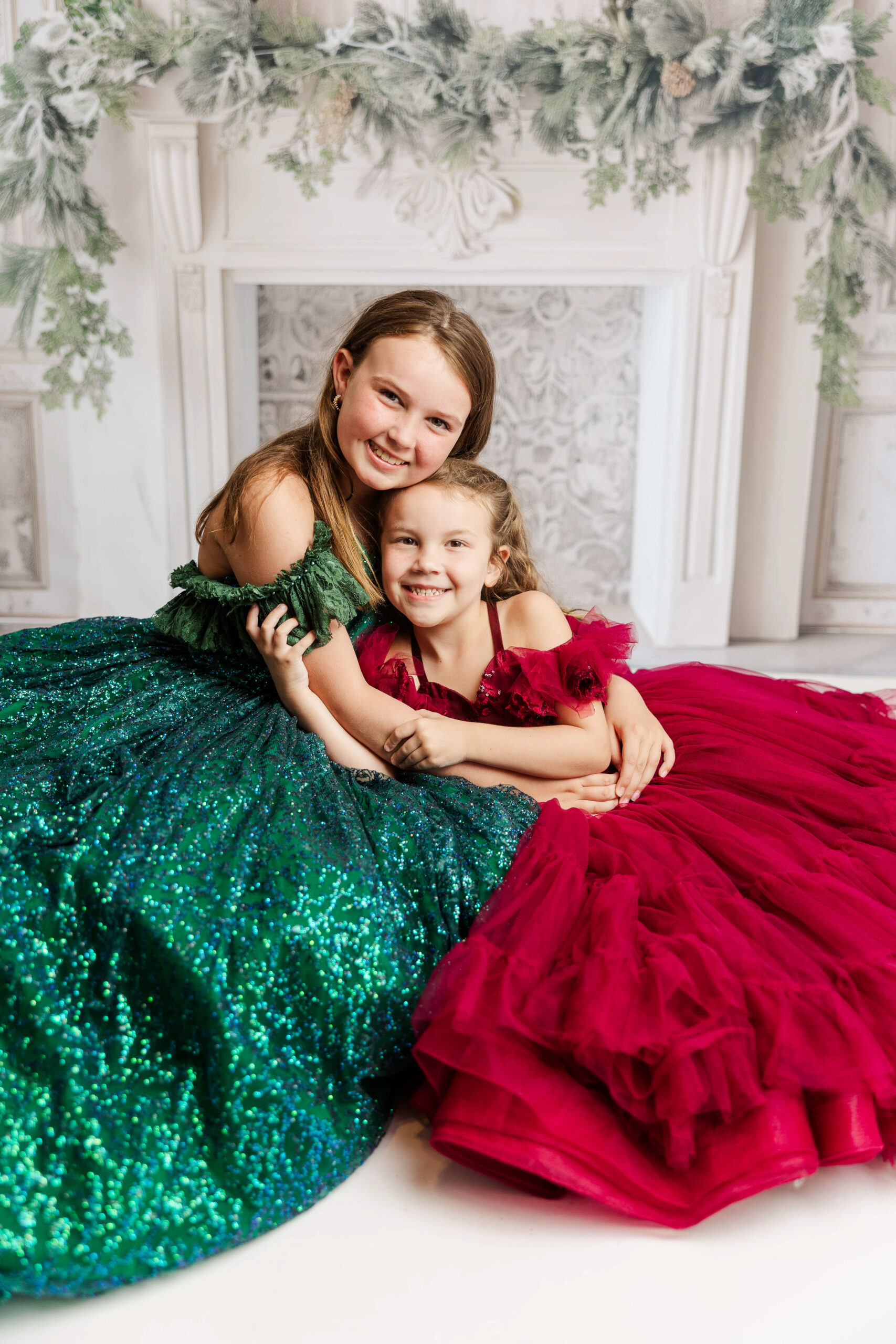 sisters hugging during fine art studio session with Molly Berry Photography