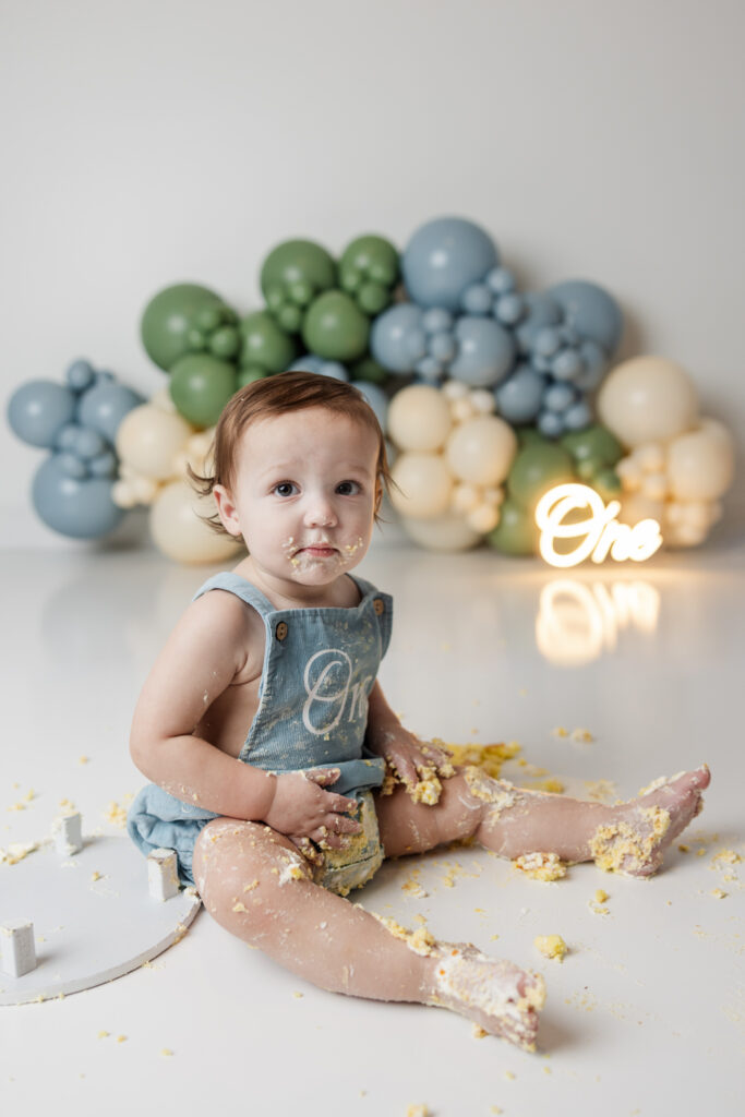 Studio session of a one year old eating cake in evans ga
