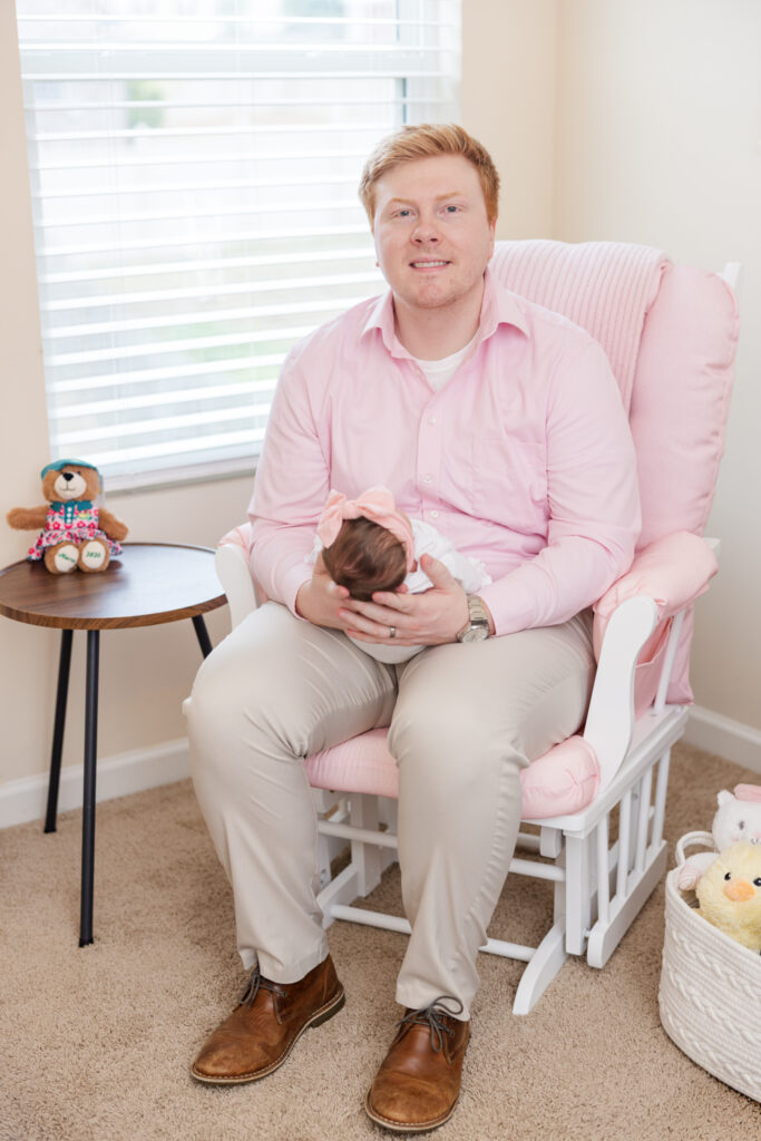 dad holding baby during newborn session