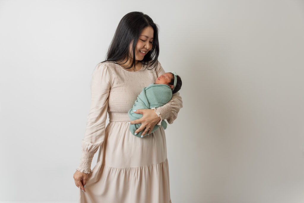 Mom holding her baby during a newborn session